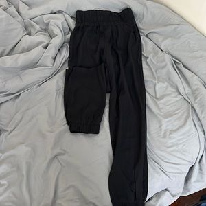 Black joggers with cuffs around ankles (pictured)